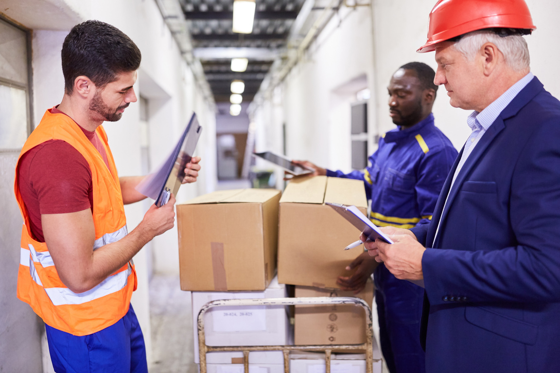 Warehouse Workers Team Controls Delivery of Goods